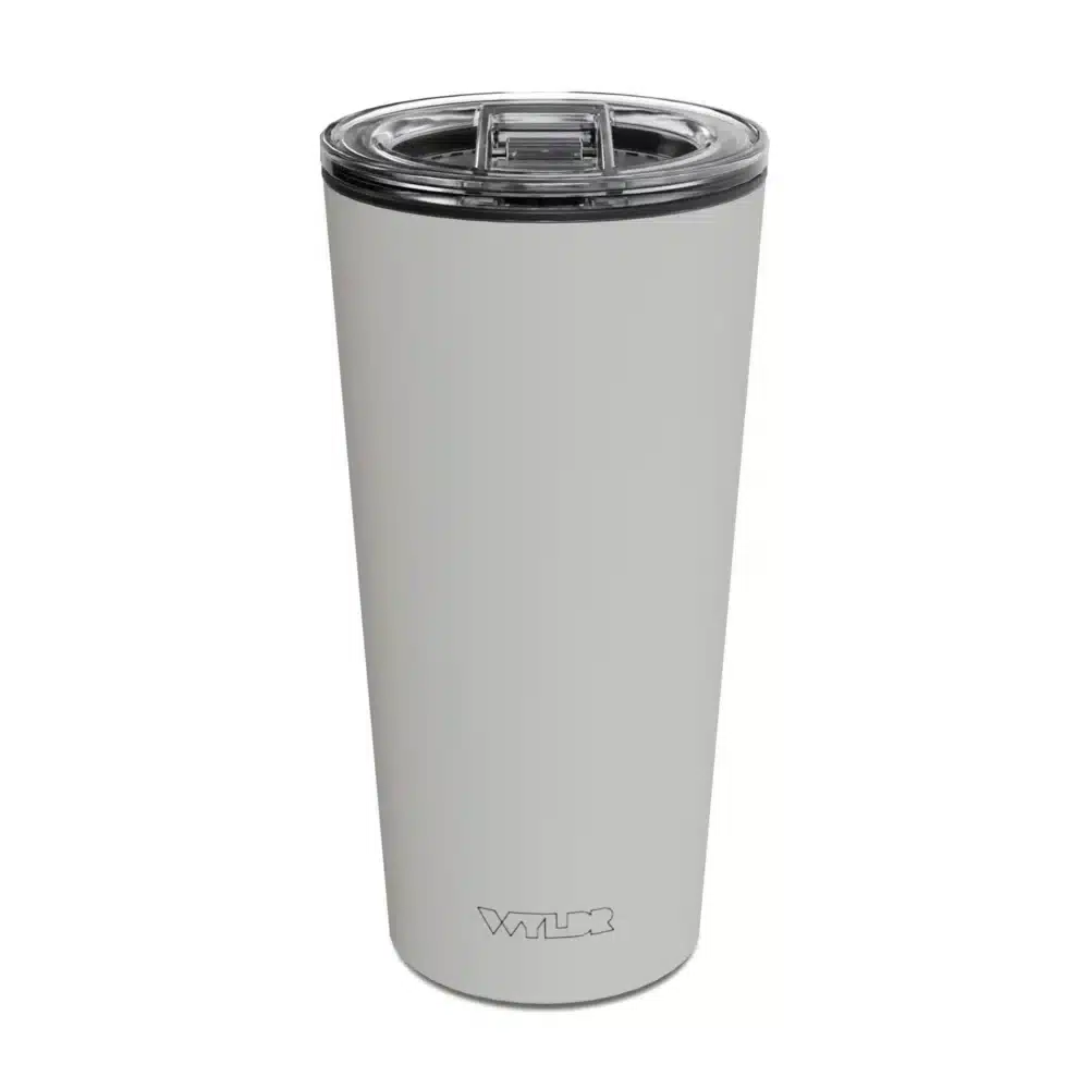 an image of a 15 oz tumbler with a glass insert and BPA-free lid made of Tritan plastic. The shell is in an off-white color called Dune and has the brand name Wyldr engraved at the bottom.