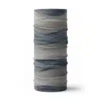 an image of a full neck gaiter. The design features lines and breaks to recreate the look of a leaf print. The colors behind the print mimic waves. This image showcases colors in blues and grays.