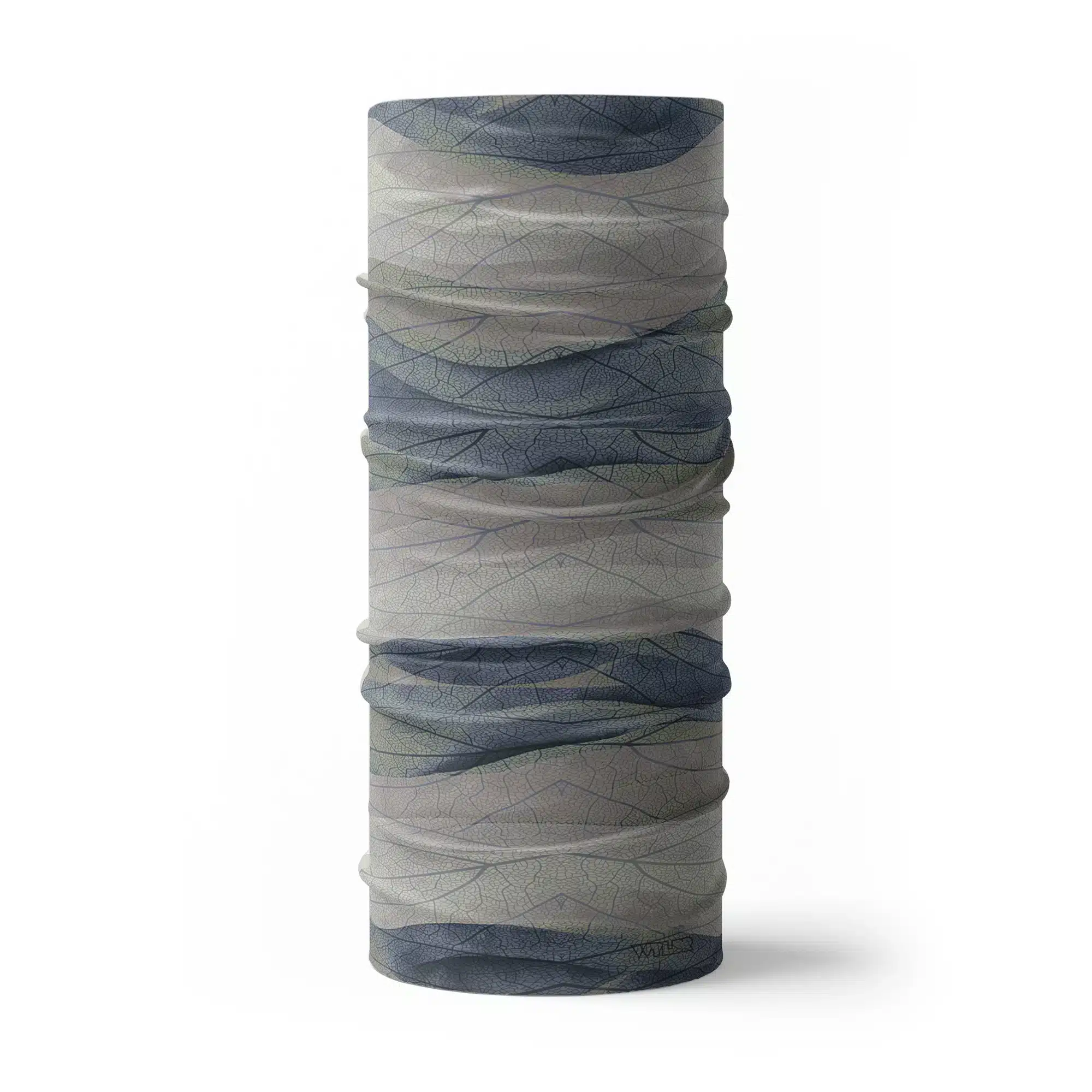 an image of a full neck gaiter. The design features lines and breaks to recreate the look of a leaf print. The colors behind the print mimic waves. This image showcases colors in blues and grays.