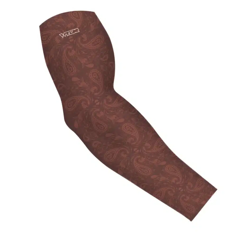 an image of an arm sleeve where paisley has been redesigned. traditional paisley elements have been replaced with different fish species. this design is available in a cedar/putty color variant