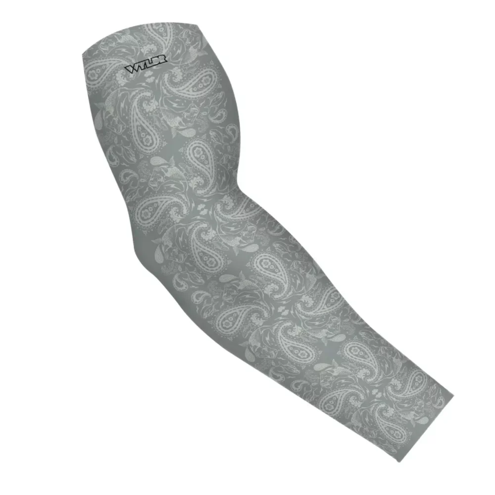 an image of an arm sleeve where paisley has been redesigned. traditional paisley elements have been replaced with different fish species. this design is available in a dune/smoke color variant