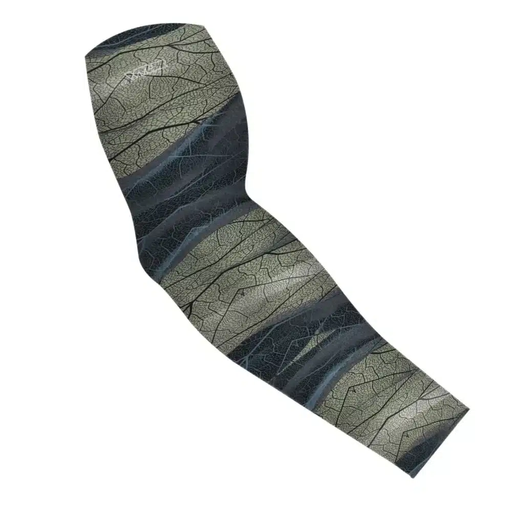 an image of an arm sleeve in an abstract pattern. lines are used to create the illusion the veins that run through leaves. the colors behind it are designed to mimic ocean waves. this is in the celery/rain color variant