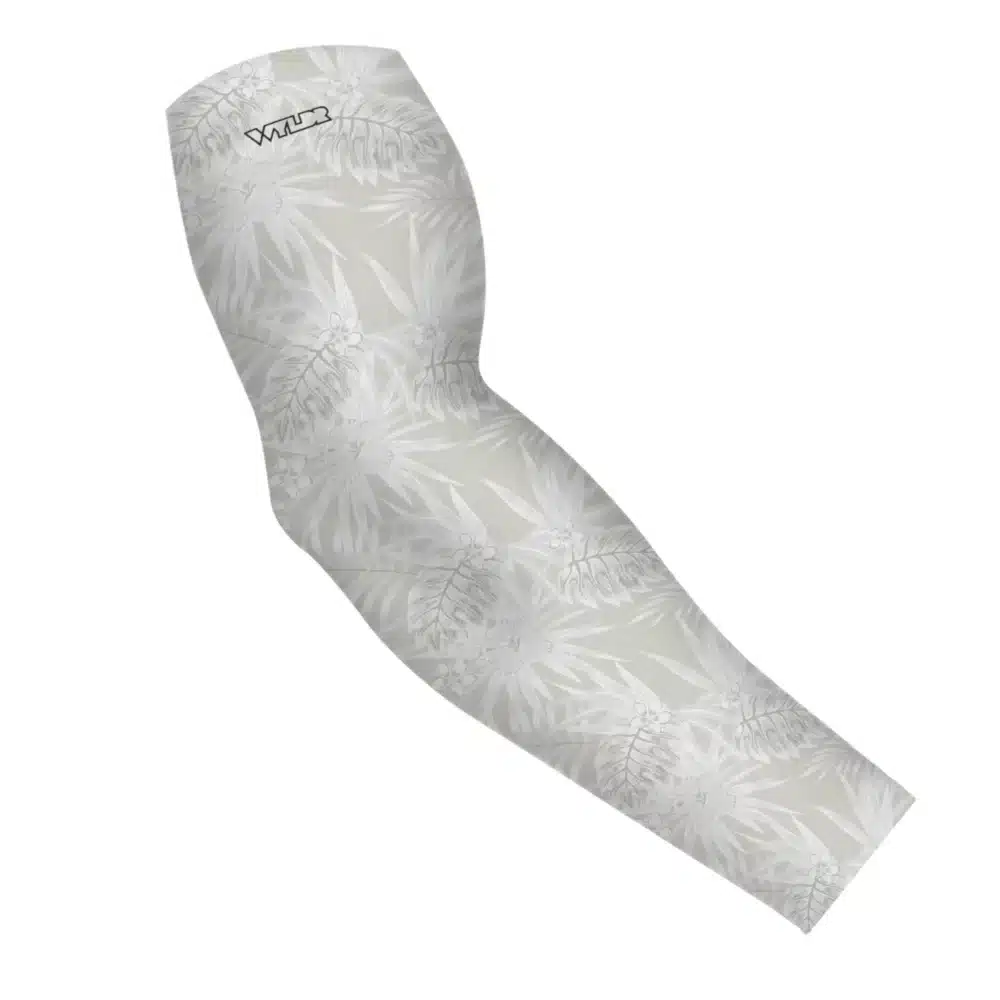 an image of an arm sleeve in an abstract pattern. lines are used to create the illusion of tropical flowers and leaves on a solid color background. this is in the dune/stone color variant