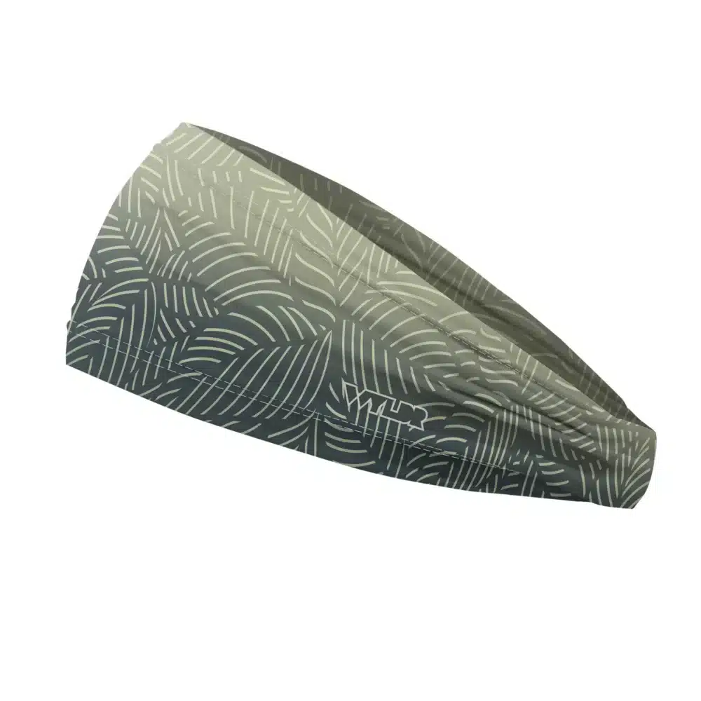 Side view of a headband that is 3 inches at the front and 1 inch in the back to show that it is tapered. This design is an abstract pattern. lines are used to create the illusion of leaves on a gradient color background. this is in the slate/sunflower color variant