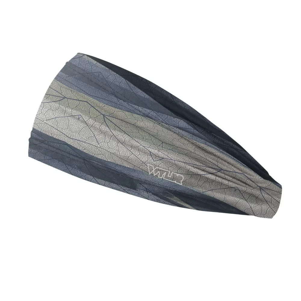 Side view of a headband that is 3 inches at the front and 1 inch in the back to show that it is tapered. The design features lines and breaks to recreate the look of a leaf print. The colors behind the print mimic waves. This image showcases cool blues and grays.