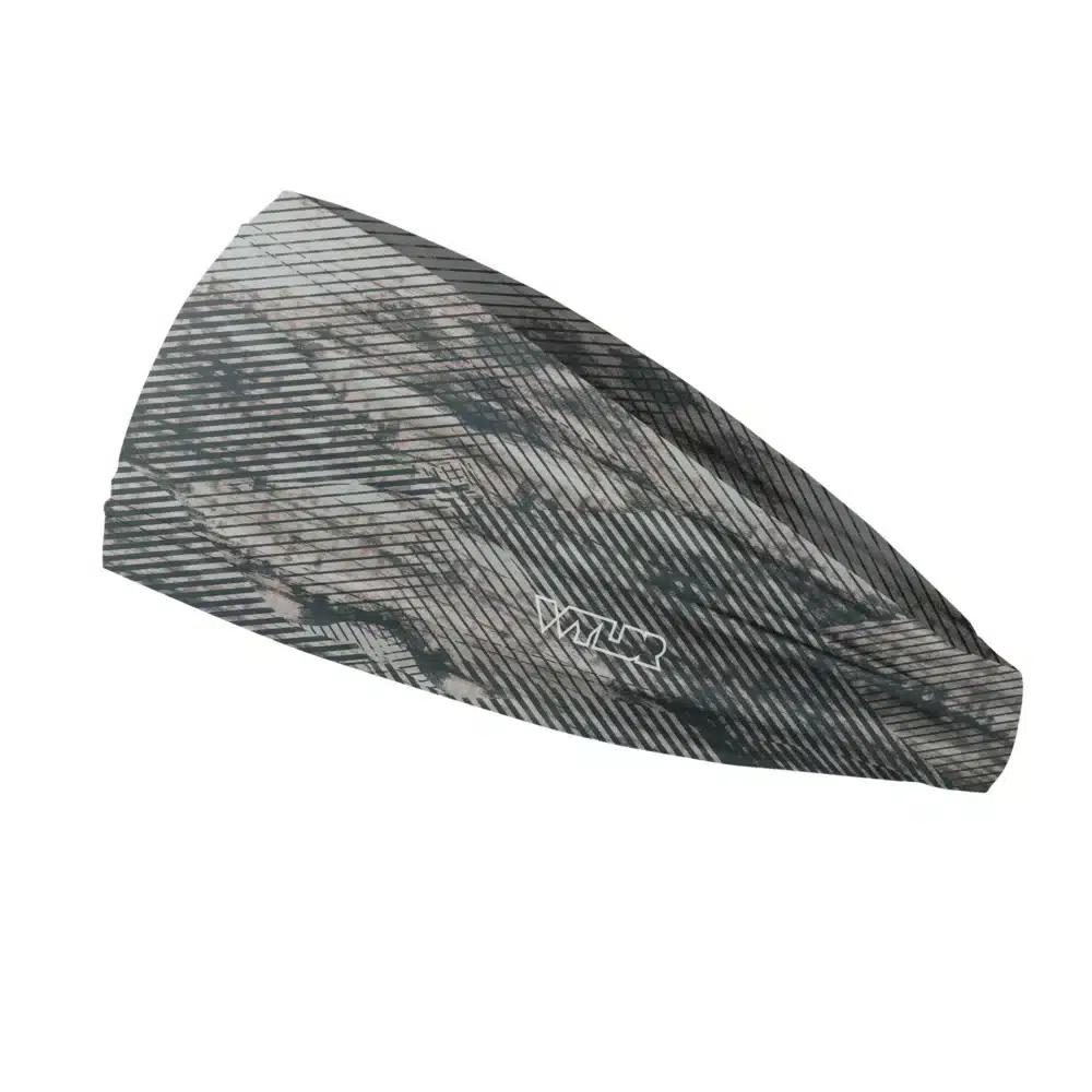 Side view of a headband that is 3 inches at the front and 1 inch in the back to show that it is tapered. the design is an abstract pattern. lines are used to create the illusion of mountain ridges. this is in the coal/hibiscus color variant