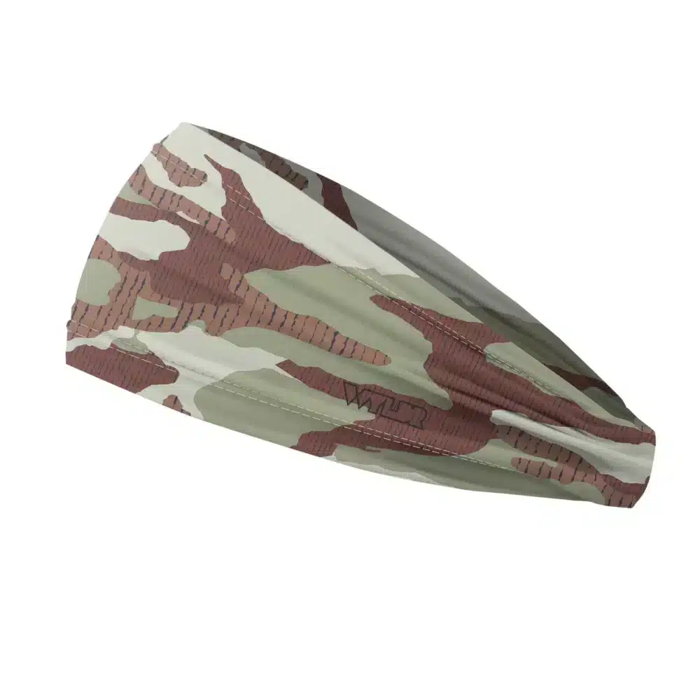 Side view of a headband that is 3 inches at the front and 1 inch in the back to show that it is tapered. inspired by current military camo, this takes that design and adds lined texture to some of the colors. featuring cedar and dune color variants