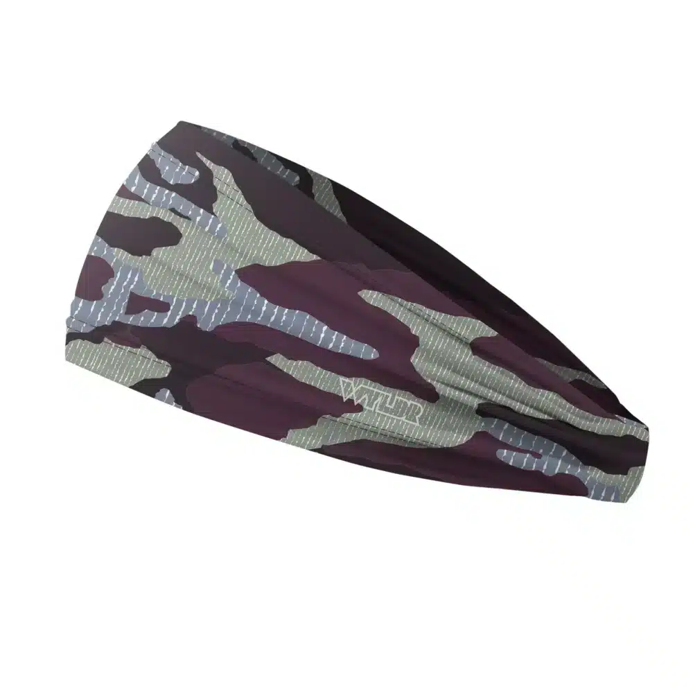 Side view of a headband that is 3 inches at the front and 1 inch in the back to show that it is tapered. inspired by current military camo, this takes that design and adds lined texture to some of the colors. featuring vine and lake color variants
