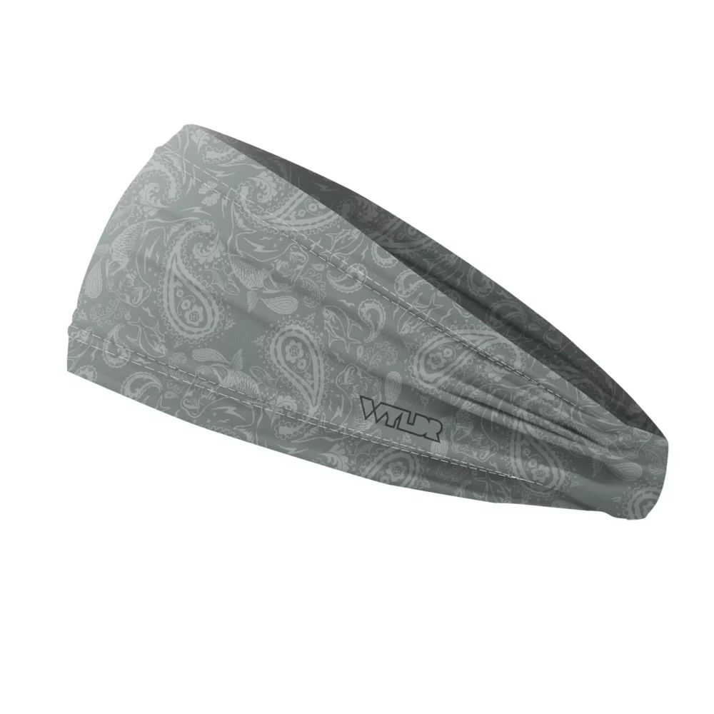 Side view of a headband that is 3 inches at the front and 1 inch in the back to show that it is tapered. traditional paisley elements have been replaced with different fish species. this design is available in a smoke/dune color variant