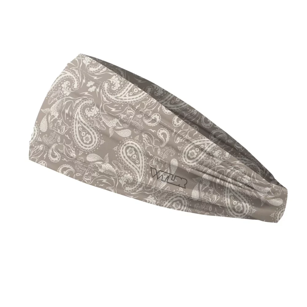 Side view of a headband that is 3 inches at the front and 1 inch in the back to show that it is tapered. traditional paisley elements have been replaced with different fish species. this design is available in a putty/dune color variant