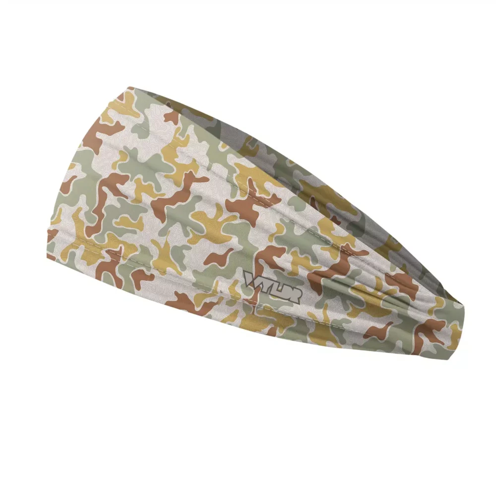 Side view of a headband that is 3 inches at the front and 1 inch in the back to show that it is tapered. this is a re-designed retro camo. a topo map has been placed behind some colors adding a new textured layer. the colors are in a celery/sunflower variant
