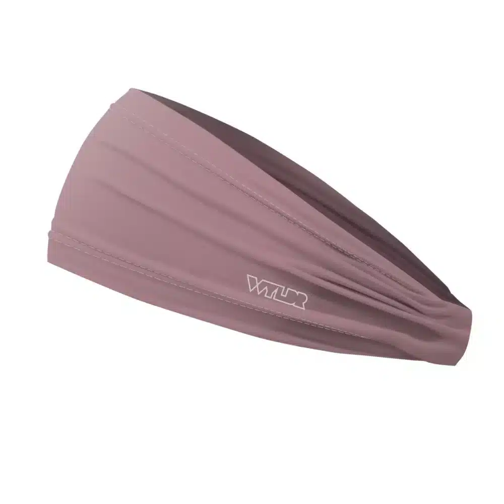 Side view of a headband that is 3 inches at the front and 1 inch in the back to show that it is tapered. this is a solid color in a pink shade called hibiscus