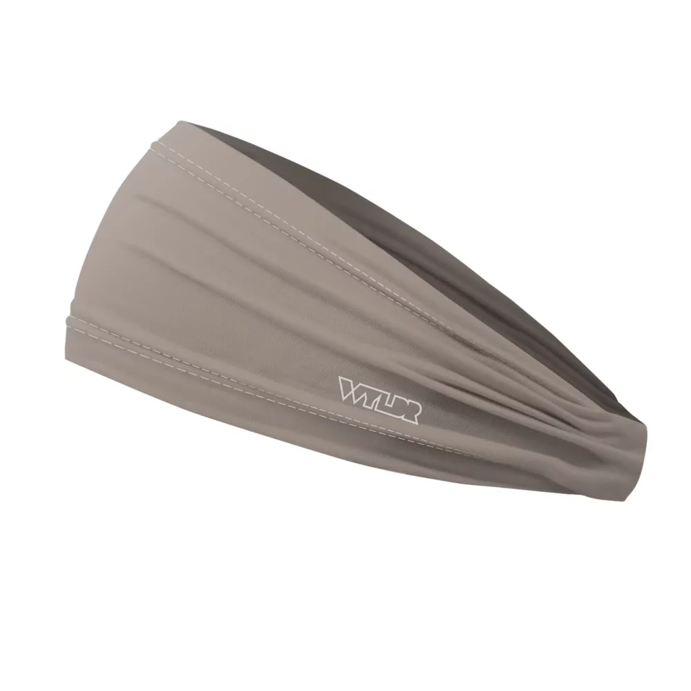 Side view of a headband that is 3 inches at the front and 1 inch in the back to show that it is tapered. this is a solid color in a tan shade called putty