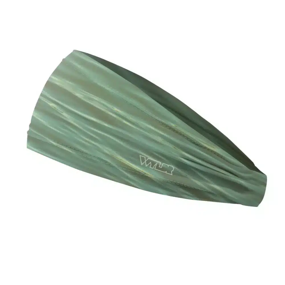 Side view of a headband that is 3 inches at the front and 1 inch in the back to show that it is tapered. The design is a ripple pattern featuring green and orange colors