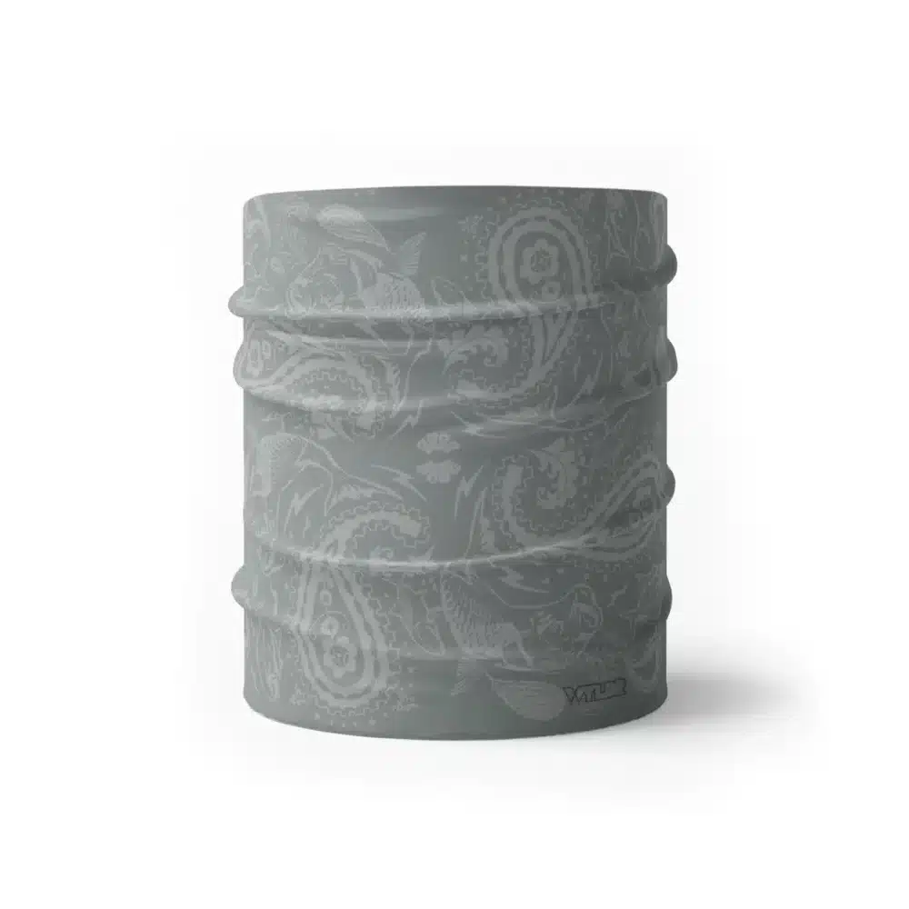 an image of a half gaiter where paisley has been redesigned. traditional paisley elements have been replaced with different fish species. this design is available in a smoke/dune color variant