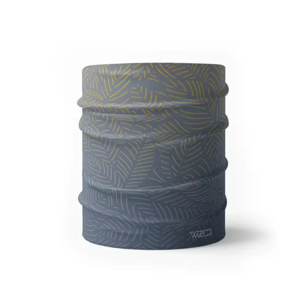 image of a wide sports headband with a crisp leaf pattern overlaid on a gradient background. The colors used in the gradiant are lake, sunflower and dune.