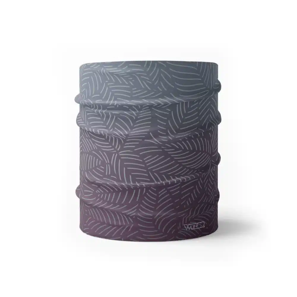image of a wide sports headband with a crisp leaf pattern overlaid on a gradient background. The colors used in the gradiant are vine, lake and dune.