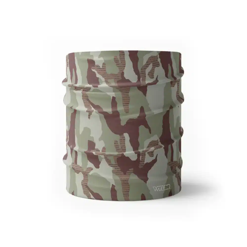 an image of half size neck gaiter in a camo pattern. inspired by current military camo, this takes that design and adds lined texture to some of the colors. featuring cedar and dune color variants