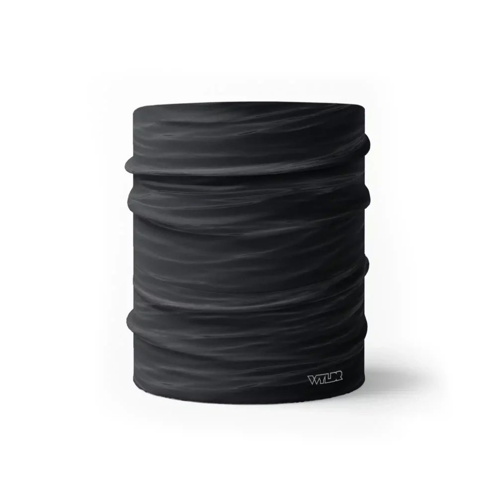 a half size neck gaiter in a ripple pattern featuring black and gray colors