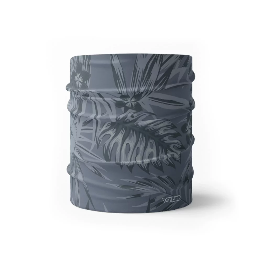 an image of a half size neck gaiter in an abstract pattern. lines are used to create the illusion of tropical flowers and leaves on a solid color background. this is in the coal/lake color variant