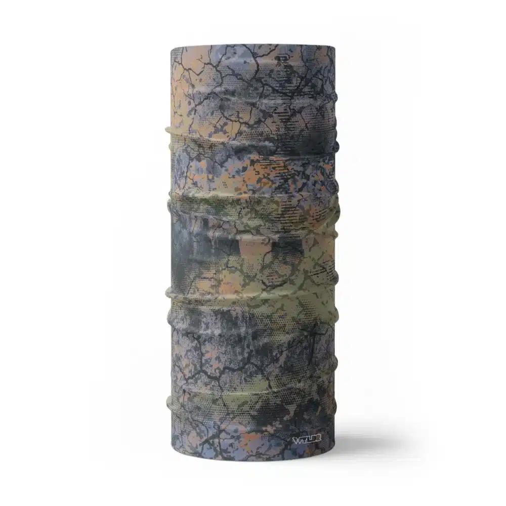 an image of a full sized neck gaiter. an abstract design in greens, corals and purples created to mimic the colorful designs found on fish