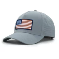 (RH) Ridge Hat | Harbor - American Flag three-quarter view of a 5 panel, water resistant, floatable hat with an embroidered american flag patch. the hat is a light blue color.