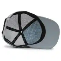 (RH) Ridge Hat | Harbor - Interior View interior view of a water resistant, floatable hat in gray-blue color. the lining has the name brand, Wyldr, and there is a two panel fabric lining in a patterned "w" logo