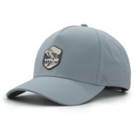 (RH) Ridge Hat | Harbor - Tarpon three-quarter view of a 5 panel, water resistant, floatable hat with a PVC patch. the patch is of a tarpon splashing out of the water and has the brand name Wyldr over it. the hat is light blue