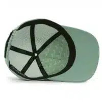 interior view of a water resistant, floatable hat in light green. the lining has the name brand, Wyldr, and there is a two panel fabric lining in a patterned "w" logo