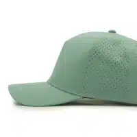 side view of a 5 panel, water resistant, floatable hat. the hat is light green in color