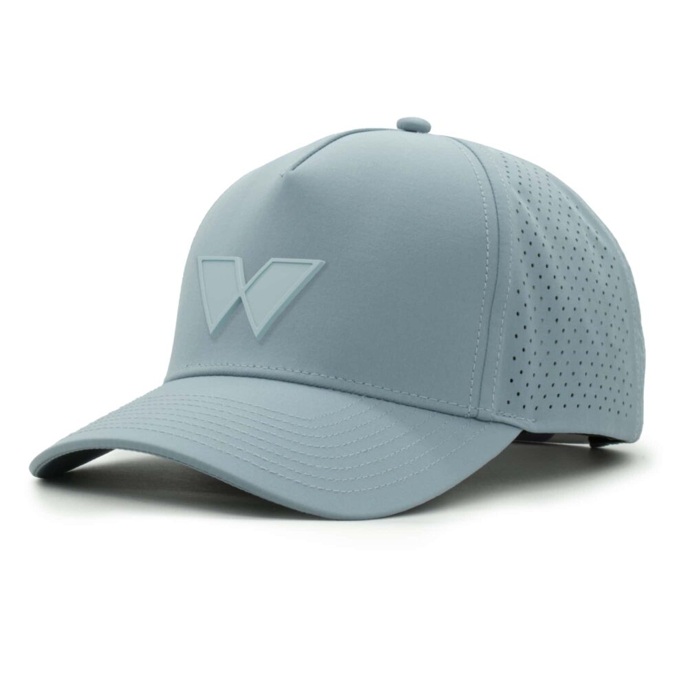 three-quarter view of a 5 panel, water resistant, floatable hat with a PVC patch. the patch is of the letter W from the brand name Wyldr. the hat is light blue. the patch matches the hat color.
