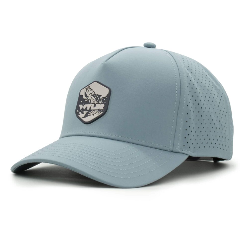 three-quarter view of a 5 panel, water resistant, floatable hat with a PVC patch. the patch is of a tarpon splashing out of the water and has the brand name Wyldr over it. the hat is light blue.