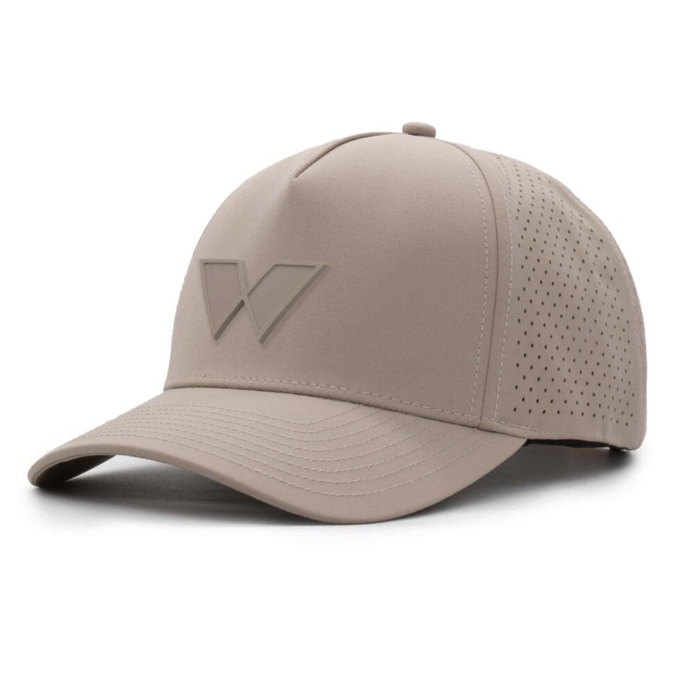 three-quarter view of a 5 panel, water resistant, floatable hat with a PVC patch. the patch is of the letter W from the brand name Wyldr. the hat is a warm tan color. The patch matches the hat color.