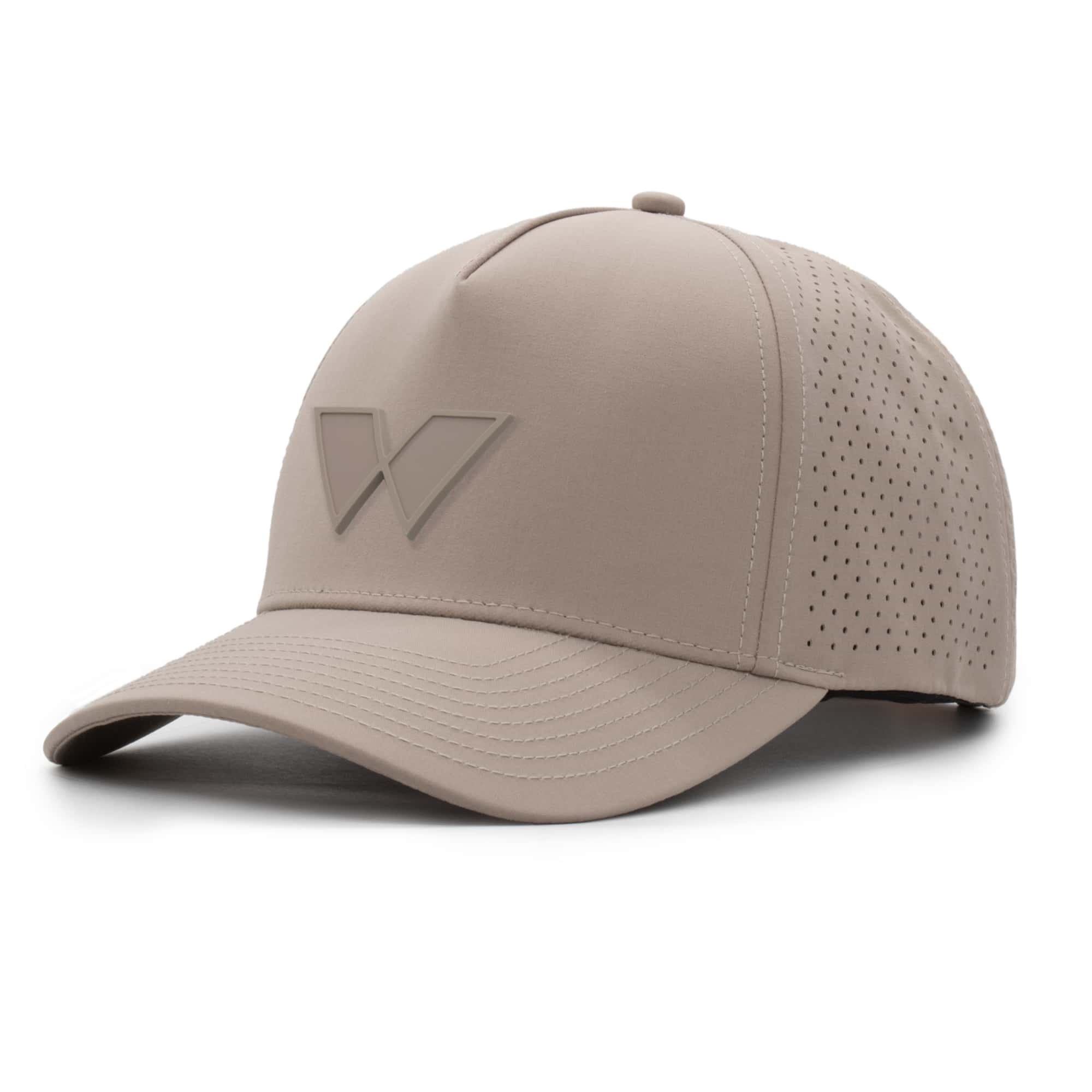 three-quarter view of a 5 panel, water resistant, floatable hat with a PVC patch. the patch is of the letter W from the brand name Wyldr. the hat is a warm tan color. The patch matches the hat color.