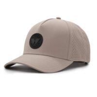 three-quarter view of a 5 panel, water resistant, floatable hat with a PVC patch. the patch is a round medallion featuring the letter W and the text Wyldr Outdoors. the hat is a warm tan color.