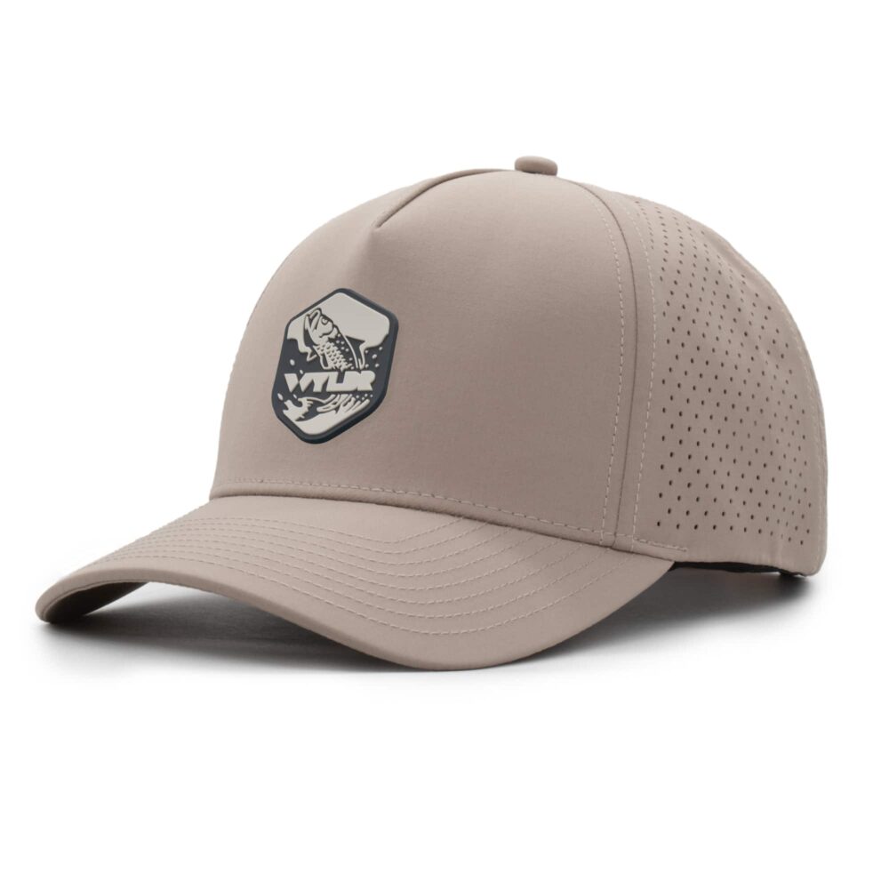 three-quarter view of a 5 panel, water resistant, floatable hat with a PVC patch. the patch is of a tarpon splashing out of the water and has the brand name Wyldr over it. the hat is a warm tan color.