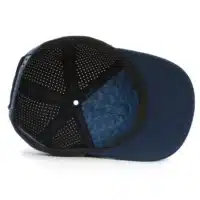 (RH) Ridge Hat | Rain - Interior View interior view of a water resistant, floatable hat in dark blue. the lining has the name brand, Wyldr, and there is a two panel fabric lining in a patterned "w" logo