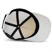 (RH) Ridge Hat | Snow - Interior View interior view of a water resistant, floatable hat in white. the lining has the name brand, Wyldr, and there is a two panel fabric lining in a patterned "w" logo