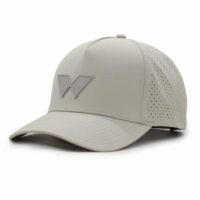 three-quarter view of a 5 panel, water resistant, floatable hat with a PVC patch. the patch is of the letter W from the brand name Wyldr. the hat is light tan. the patch matches the hat color.