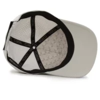 (RH) Ridge Hat | Stone - Interior View interior view of a water resistant, floatable hat in tan. the lining has the name brand, Wyldr, and there is a two panel fabric lining in a patterned "w" logo