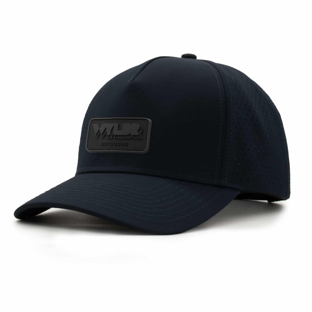 three-quarter view of a 5 panel, water resistant, floatable hat with a PVC patch. the patch is the brand name Wyldr contained in a rounded rectangle. the hat is black.