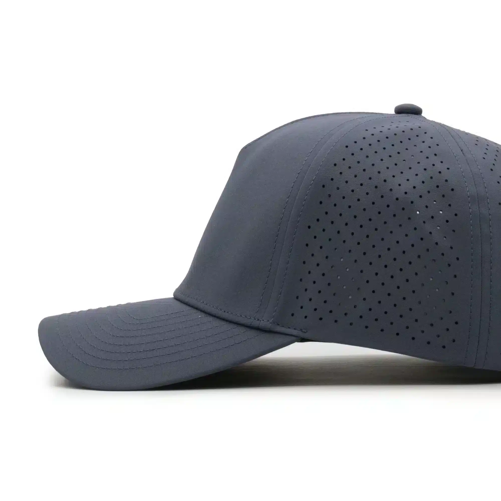 side view of a 5 panel, water resistant, floatable hat. the hat is dark blue-gray in color